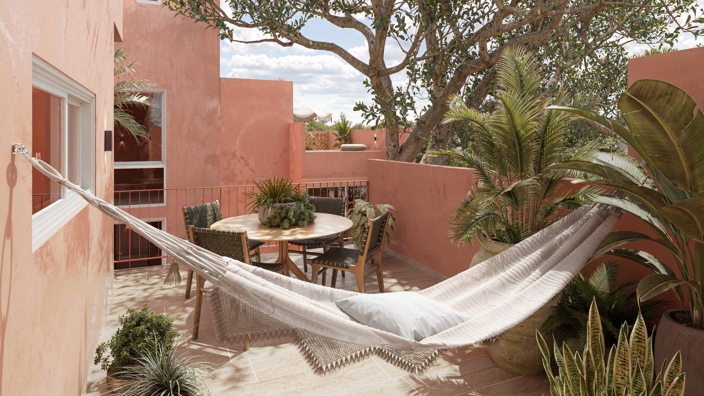 Terraza privada con hamaca rodeada de vegetación